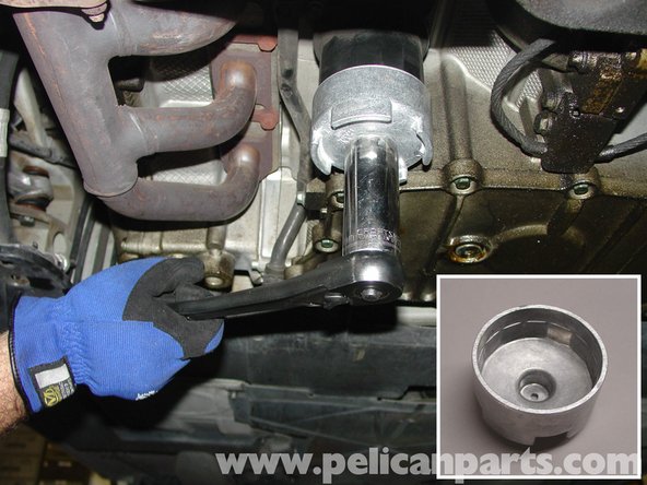 Use 14 Flute Oil Filter Cap Removal tool to loosen Plastic Filter Cap