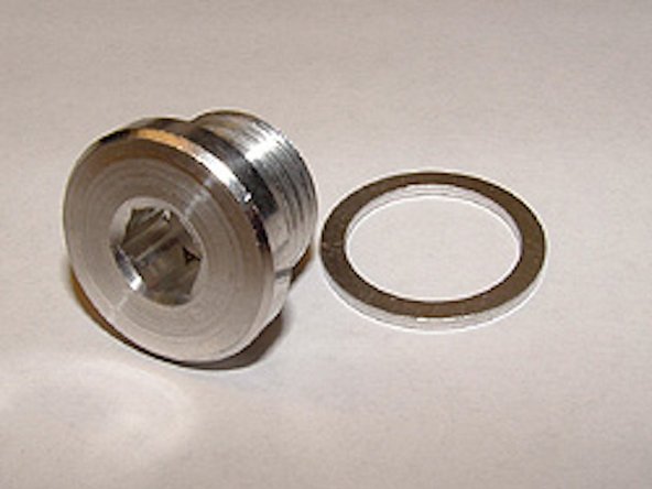 Using 8mm Hex Socket, remove drain plug