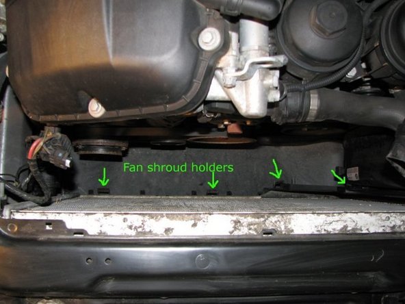 Take a look where the shroud was in the car and note the location of the retaining clips on the car. You will need to make sure that the shroud slips into all of them properly when putting it back in.