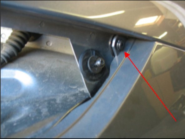 In the far corner is a small fastener securing a tab on the bumper to the quarter panel, remove.