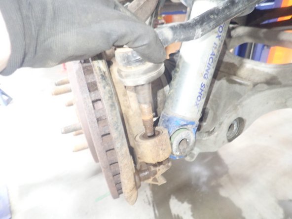 Separate the tie rod end from the steering knuckle.