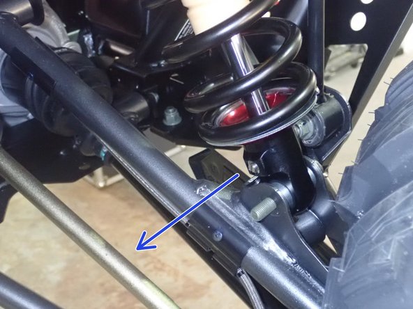 On Stage 2, Stage 4 and Stage 5 models, the lower shock eyelets should be installed with the rebound adjuster oriented towards the rear of the vehicle as shown by the blue Arrow on the photo ( Right side shown ). If needed, you can turn the lower eyelet to orient properly.