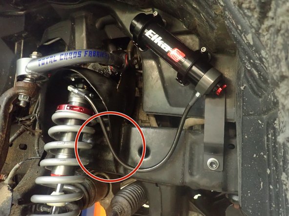 Install Elka shocks using OEM lower bolts and provided upper bolts. Hoses must face front of vehicle as shown (right side shown).