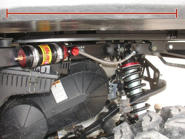 Secure the remote reservoir to the frame using the provided rubber mounts as shown: