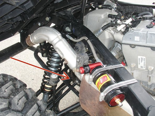 Secure the remote reservoir to the frame using the provided rubber mounts as shown: