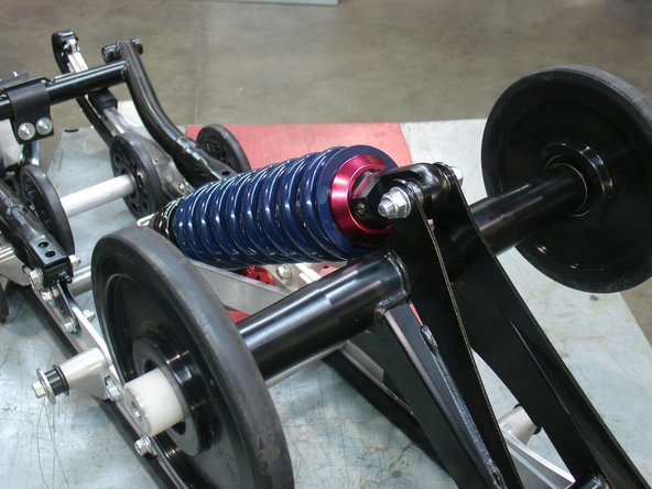 The shock head is mount downward with the rebound adjuster pointing either the left or right side.