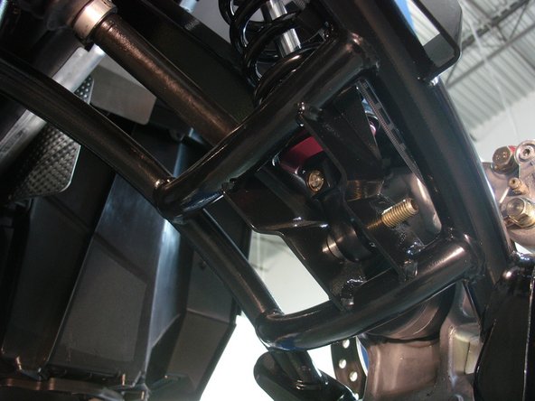 On Stage 2, Stage 4, and Stage 5 models the rebound adjuster located on lower eyelet of the shocks should be oriented towards the inside of the vehicle, as shown. (Right side shown ). If needed, you can turn the lower eyelet to orient properly. This way you can have access to the rebound screw Under the lower arm.