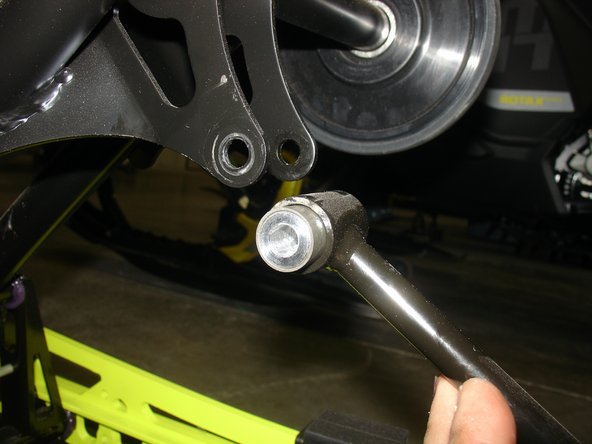 Remove the upper bolt of linkage arm.