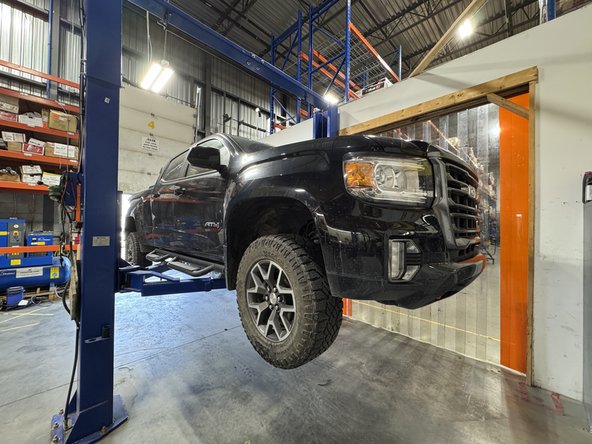 Lift the vehicle off the ground, then remove the wheels.