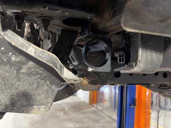 The longer part of the bracket need to face the rear of the truck as show by the red arrow.