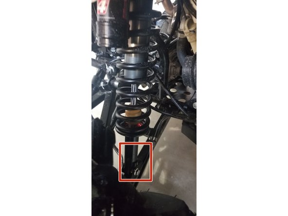 On Stage 2, Stage 4, and Stage 5 models the rebound adjuster located on lower eyelet of the shocks should be oriented towards the front of the vehicle, as shown. (Right side shown ). If needed, you can turn the lower eyelet to orient properly.