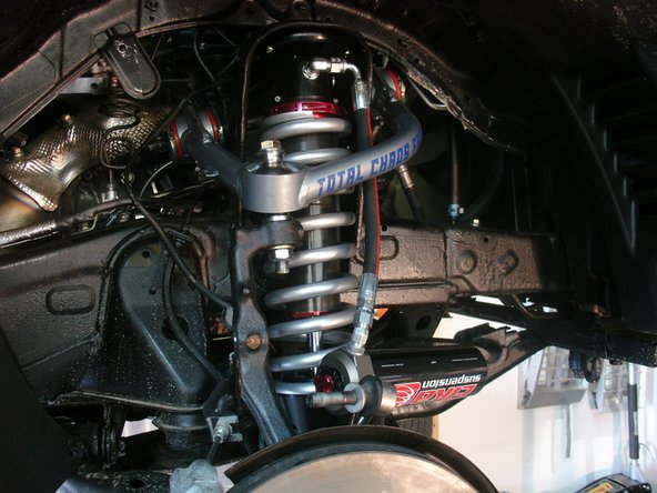 Install the upper arm.