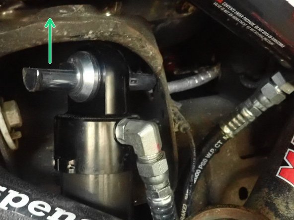 For the upper mount, make sure the stud's flats are facing up as shown by green arrow. The pin can be turned if nesessary.