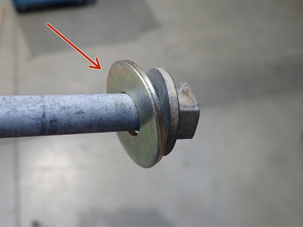 Install new Elka rear shocks with the reservoir upside and facing the rear of vehicle. (Right side shown).