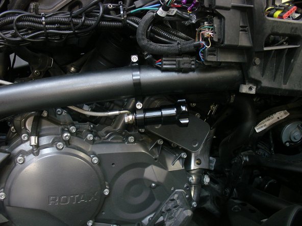 For hydralic preload with a Stage 2 shock, fix the adjuster directly to the frame with supplied bracket as shown. Torque the 2 bolts at 10 ft/pnds.