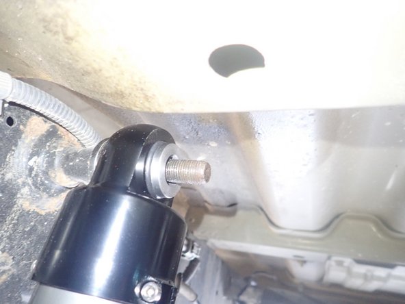 Slide shock's upper end on upper stud, then slide second spacer/o-ring assembly. O-ring must face spherical bearing.