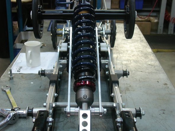 The shock head is mount downward with the rebound adjuster pointing either the left or right side.