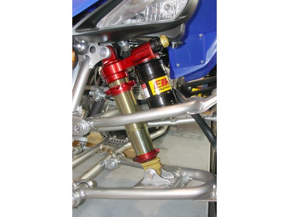 Lift the vehicle off the ground with a jack or on a stand. Remove the stock shock absorbers from the vehicle (refer to the manufacturer’s documentation).