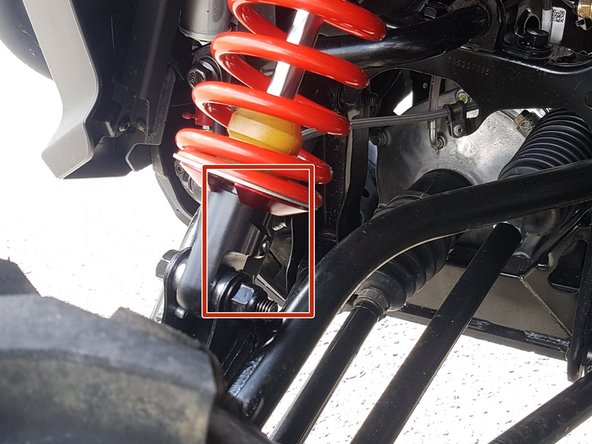 On Stage 2, Stage 4 and Stage 5 models, the lower shock eyelets should be installed with the rebound adjuster (red square) oriented towards the back of the vehicle as shown by the Red square on the photo ( left side shown ). If needed, you can turn the lower eyelet to orient properly.