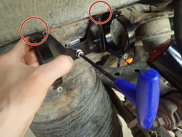 Areas shown by red circles can touch bracket clamps in application because the body is mounted on rubber. We suggest to trim metal sheet around this areas.