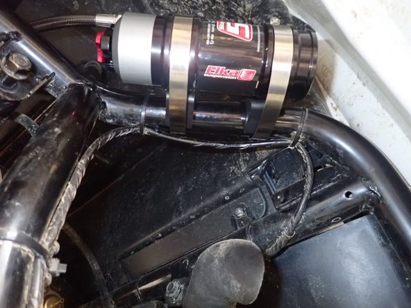 Place rubber isolators between frame and reservoir as shown, then tighten  collars