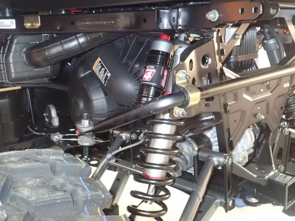 Install the rear new Elka shocks with the reservoir ( on Stage 3-4-5 ) or Schraeder nitrogen valve ( on Stage 1-2 ) at the top of vehicle. ( Left side shown ).