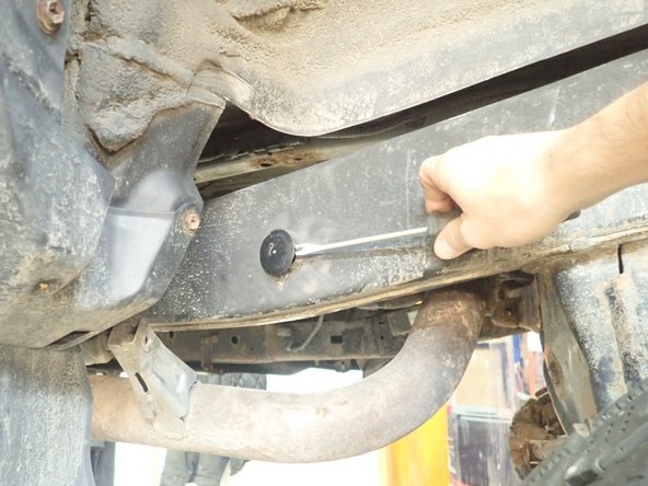 Remove plastic caps located rearward the rear wheels outside and Inside the frame.