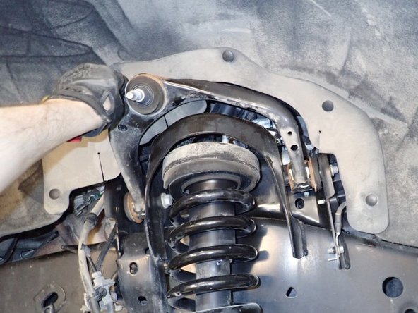 Push the lower arm as far as you can, then remove oem front shocks.