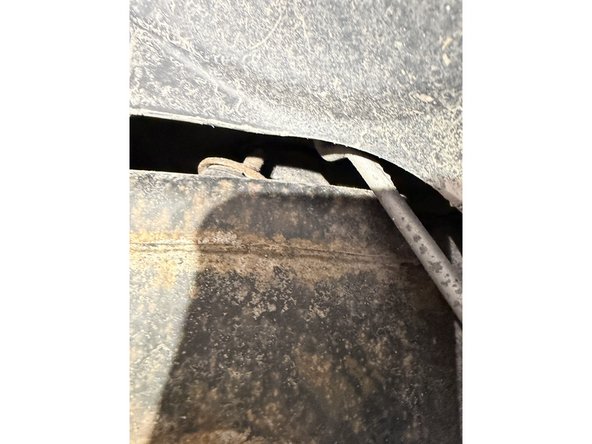 Remove upper nuts and lower bolts, then remove OEM shocks.