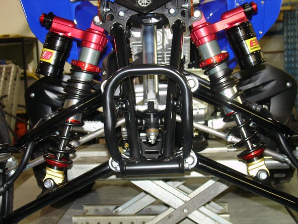 Lift the vehicle off the ground with a jack or on a stand. Remove the stock shock absorbers from the vehicle (refer to the manufacturer’s documentation).