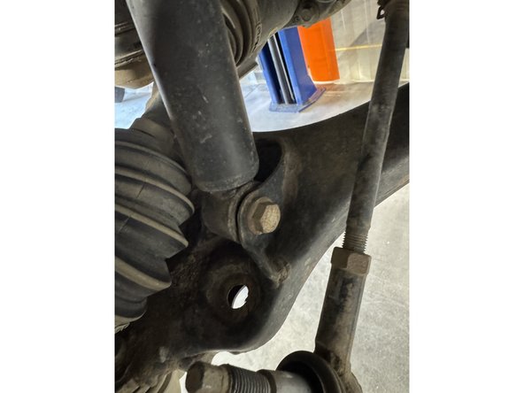 Remove the bolts from the lower shock mounts. Keep the OEM lower bolt.