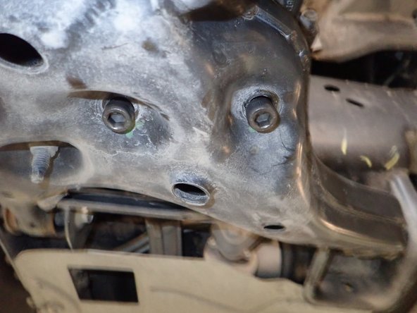 Install supplied upper bolts and washers, then do the same for lower mounting bolts. Tighten all bolts.