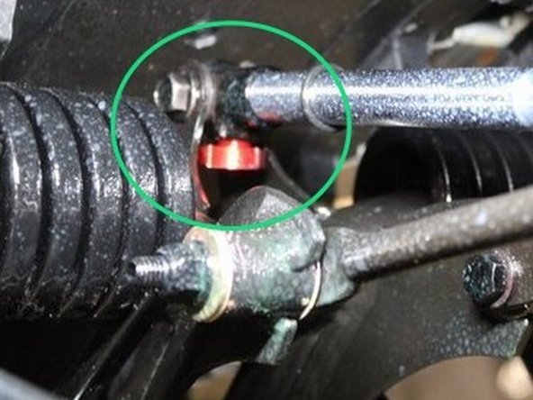 Install the Elka rear shock with the reservoir upside and oriented towards the front of the snowmobile as shown on the photo.