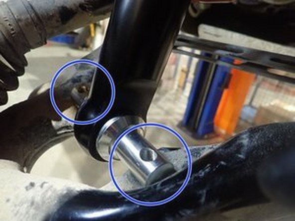 To install your new Elka shocks, do the inverse procedure showed on step 4. Shock reservoirs must face to the front of vehicle. You may have to push lower suspension arm to put the shocks in place. (Right side shown). Torque bolt ot factory specs.