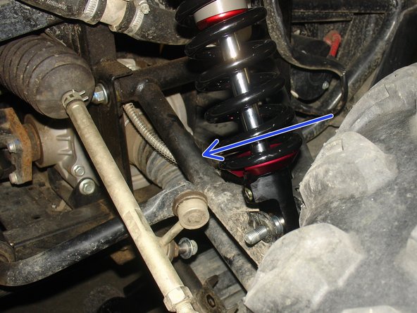 On Stage 2, Stage 4 and Stage 5 models, the lower shock eyelets should be installed with the rebound adjuster oriented towards the rear of the vehicle as shown by the blue Arrow on the photo ( Right side shown ). If needed, you can turn the lower eyelet to orient properly.