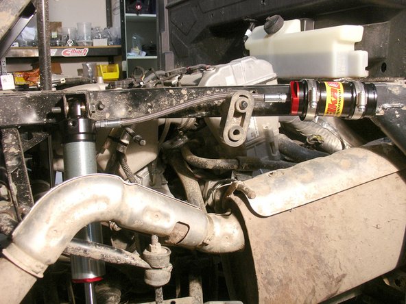 The RIGHT REAR SHOCK is the one with the hose attached directly to the shock.