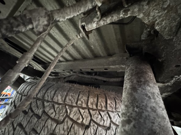 Remove upper and lower bolts from OEM shocks. Keep OEM bolts to install Elka shocks.