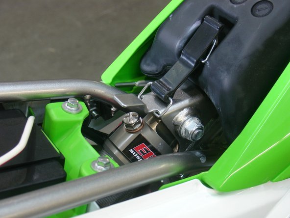 The valve should be oriented toward the rear of the vehicle as it's shown on the picture.