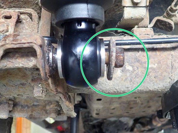 To install new Elka shocks, use a jack or an underhoist to compress rear axle to align both truck's studs with the shock's ends. Make one side at the time, and place head of shock to the top.