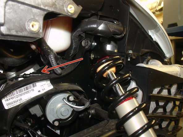 On Stage 2, Stage 4 and Stage 5 models, the upper shock eyelets should be installed with the rebound adjuster oriented towards the rear of the vehicle as shown by the red Arrow on the photo ( right side shown ). If needed, you can turn the lower eyelet to orient properly.