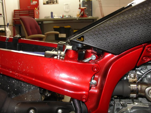 The hose needs to be on the right side of the quad when you install the upper bolt on the suspension.