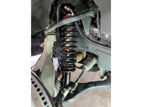 Reassemble the tie rod end, then torque the nut to 70 Ft-Lb.