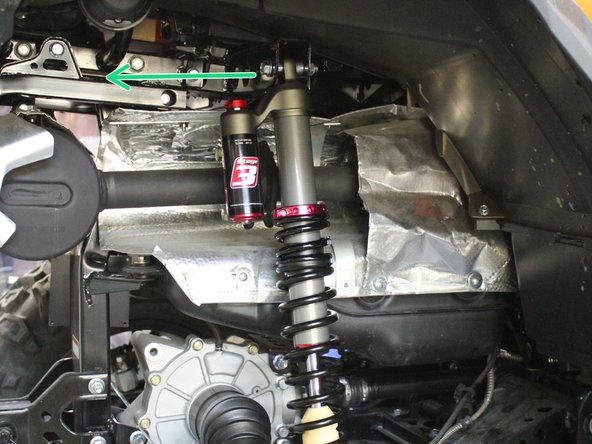 Install both new Elka rear shock with the piggyback reservoir at the top and oriented towards the rear of the vehicle as indicated by the green Arrow on the photo. ( Right side shown)