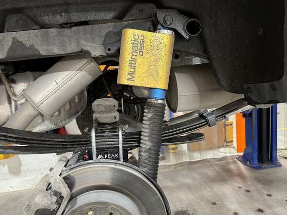 Remove upper and lower bolts from OEM shocks. Keep OEM bolts to install Elka shocks.
