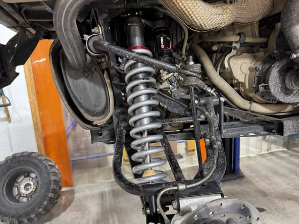 On Stage 2, Stage 4 and Stage 5 models, the lower shock eyelets should be installed with the rebound adjuster oriented towards the back of the vehicle. If needed, you can turn the lower eyelet to orient properly.