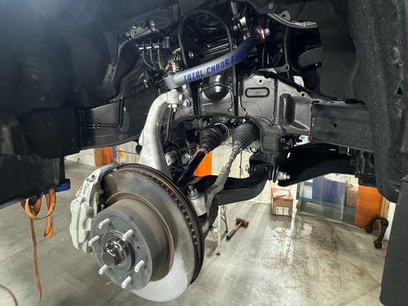 Remove the shock from the vehicle.