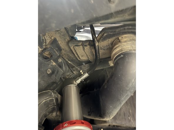 On the right side, make sure the hose clear the air intake as shown.