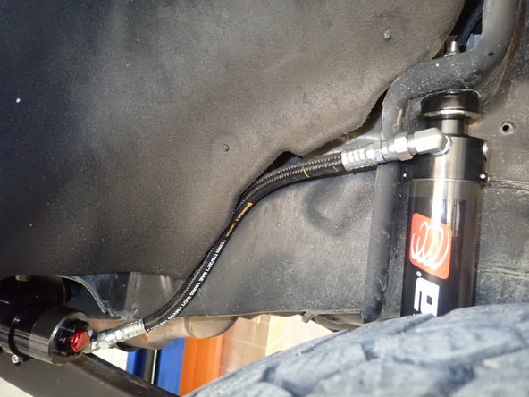 Apply some threads locker ,then torque clamp's bolts at 10 lb/ft.