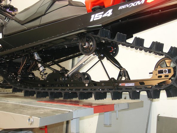 Remove the two spring supports to remove any tension on the torsion springs.