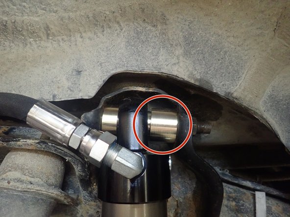 Upper offset spacers are used on 2.5'' shock's head, be sure larger spacer is on the opposite side of reservoir as shown by red circle.